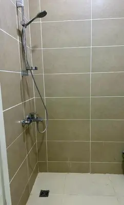a shower with a shower head in a bathroom at Luxury Escape in Hurghada, Egypt in Hurghada