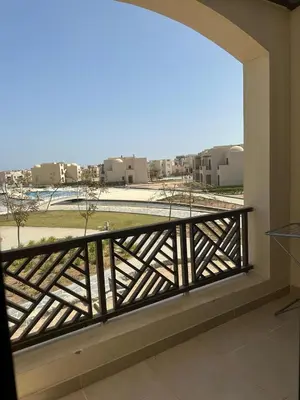 a balcony with a view of a building at Luxury Escape in Hurghada, Egypt in Hurghada
