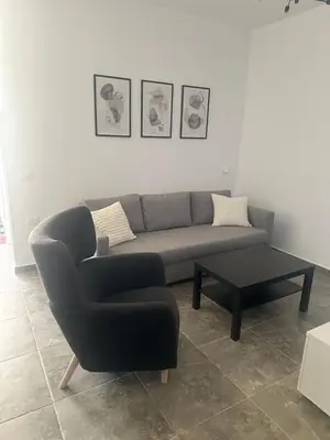 a living room with a couch and a coffee table at Aqua Infinity in Hurghada