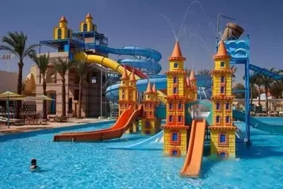 a water park with a water slide in the water at ميراج باي in Hurghada