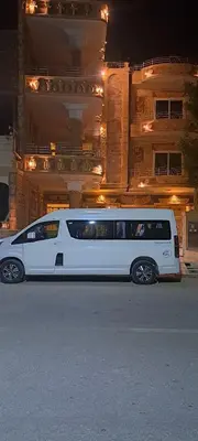 a white van parked in front of a building at Egypt Soul hotel retreat in Luxor