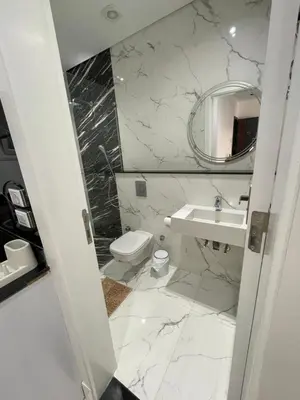 a bathroom with a sink and a toilet and a mirror at Endless Summer Apartment House W7 in Safaga