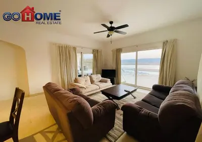 a living room with a couch and a ceiling fan at Spacious Villa 4 Broom Private Pool V35 at White villa in Hurghada