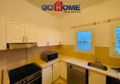 a kitchen with a sink and a microwave at Spacious Villa 4 Broom Private Pool V35 at White villa in Hurghada