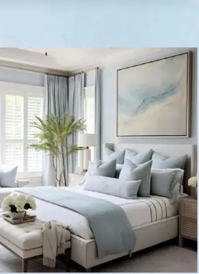 a bedroom with a large white bed and a painting at Royal Jade wellness luxurios Dahabiya Nile Cruise Every Monday from Luxor to Aswan 4 nights and Every Friday from Aswan to Luxor 3 nights in Luxor