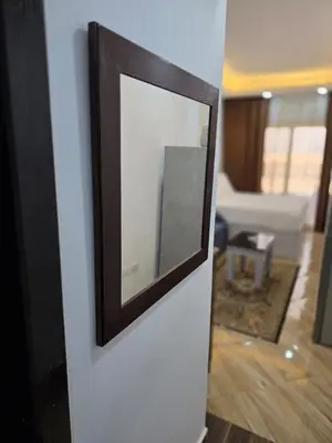 a mirror on a wall in a living room at cecelia resort in Hurghada