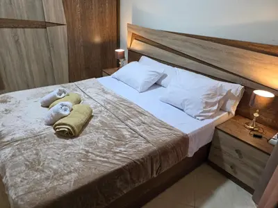 a bedroom with a bed with towels on it at Do wynajęcia apartament w Hurghadzie w resorcie Aqua Tropical in Hurghada
