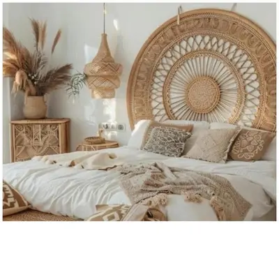 a bed with a large wooden headboard in a bedroom at Royal Amber in Luxor