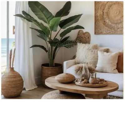 a living room with a coffee table and a plant at Royal Amber in Luxor