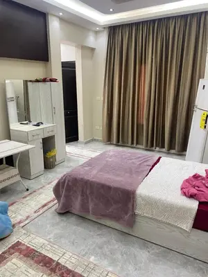 a bedroom with a large bed and a large window at Al fayrouz resort in Hurghada