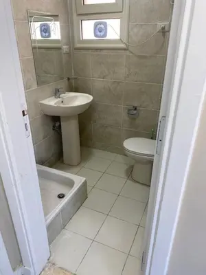 a bathroom with a sink and a tub and a toilet at Al fayrouz resort in Hurghada