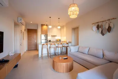 a living room with a couch and a table at Shedwan 2BR • Exquisite Ground Floor in Hurghada