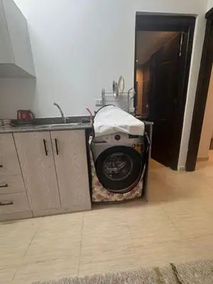 a microwave sitting on a counter in a kitchen at Florenza Khamasin C105 in Hurghada