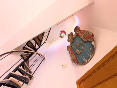 a staircase in a house with a chandelier at Super Central Somabay 2BR Marina Apt w Free Beach in Hurghada