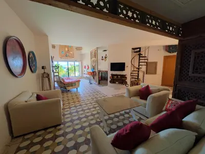 a large living room with couches and a television at Super Central Somabay 2BR Marina Apt w Free Beach in Hurghada