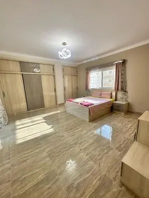 a large bedroom with a bed and a window at Hurghada oasis 2 in Hurghada