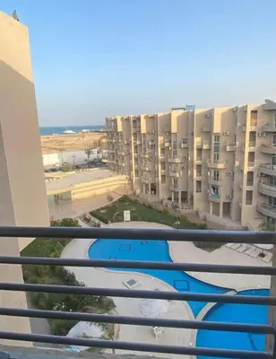 a view from a balcony of a apartment building at Princess Resort in Hurghada