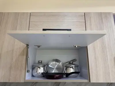 a shelf in a kitchen with pots and pans at La Quinta Hurghada Pool & Sea View Ground floor in Hurghada