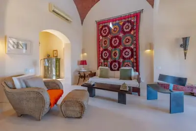 a living room with a couch and chairs and a rug at Stylish Villas in North Golf El Gouna in Hurghada