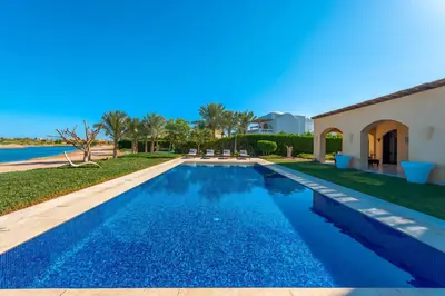 a swimming pool in the backyard of a villa at Stylish Villas in North Golf El Gouna in Hurghada