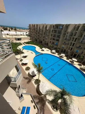 an overhead view of a large swimming pool in a building at Studio Pool & Sea View Princess Resort in Hurghada