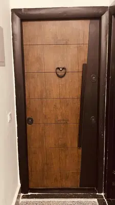 a wooden door with a handle on it at Modern apartment for rent in Hurghada