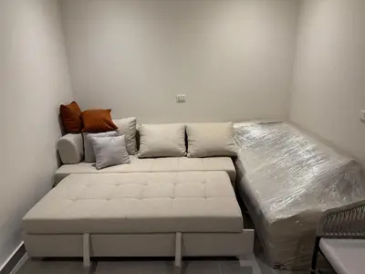 a large bed in a room with a couch at Old Sheraton street apartment in Hurghada
