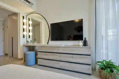 a bathroom with a sink and a mirror at Modern 3BR Poolside Apt at Cribs El Gouna in Hurghada