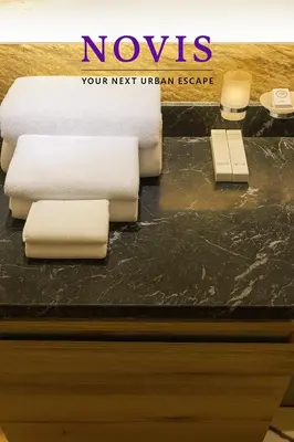 a counter with towels on a table in a room at Novis Holiday Homes Sahl Hasheesh in Hurghada