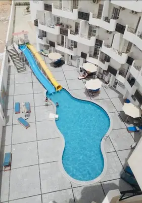 an aerial view of a swimming pool in a building at Tiba view in Hurghada