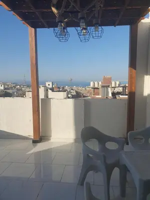 a chair sitting on top of a building with a view at Apartment sea view in Hurghada
