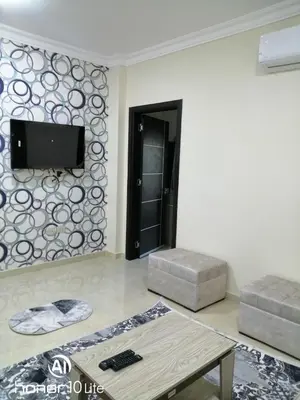 a living room with a flat screen tv on a wall at La quinta hights in Hurghada