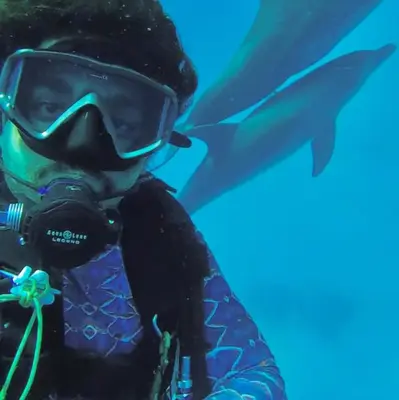 a person with a camera next to a fish at Private Diving in Hurghada in Hurghada