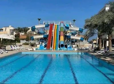 a water slide in the middle of a swimming pool at Fanadir Bay Elnoras213 Hurghada in Hurghada