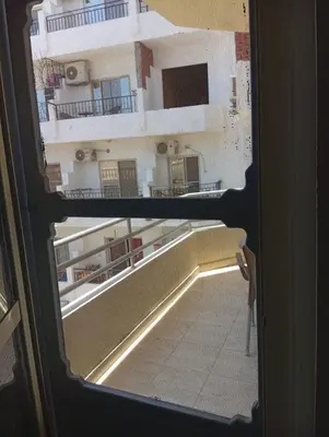 a view of a room through a window at شقه للإيجار مكيفه in Hurghada
