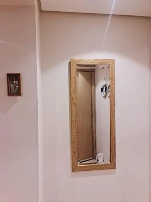 a mirror on the side of a white wall at 1 bedroom in mangroovy El gouna in Hurghada