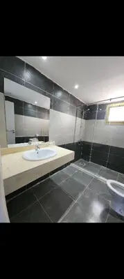 a bathroom with a sink and a toilet at Fanadir bay resort in Hurghada