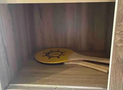 a wooden guitar case with a picture at Luxurious Cozy studio in Sahl Hasheesh Hurghada in Hurghada
