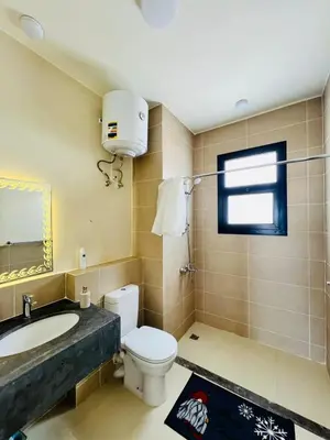 a bathroom with a toilet and a sink at Sea View Serenity - Stylish 2BR Retreat in Hurghada