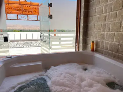 a bath tub filled with lots of snow at Spacious Luxury Nile-View Apartment on Upper Floor with Rooftop, Jacuzzi & BBQ ,Steps from Hilton Hotel in Luxor