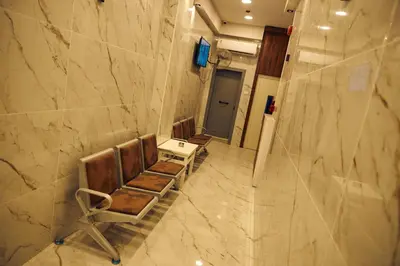 a bathroom with chairs and a table and a sink at Town Hotel- Hurghada in Hurghada