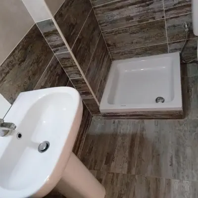 a bathroom with a sink and a bath tub at George Villa in Hurghada