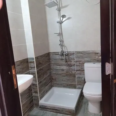 a bathroom with a toilet and a sink and a shower at George Villa in Hurghada