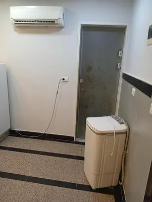 a room with a heater and a room with a door at ميراج باي اكوا بارك in Hurghada