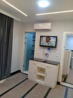a hospital room with a tv on the wall at ميراج باي اكوا بارك in Hurghada