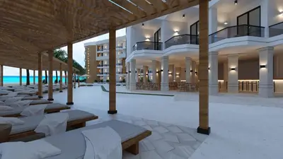 a large building with tables and chairs in a courtyard at Red Sea Sanctuaries in Hurghada