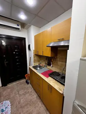 a kitchen with a sink and a stove in it at Florenza Khamsin GH in Hurghada