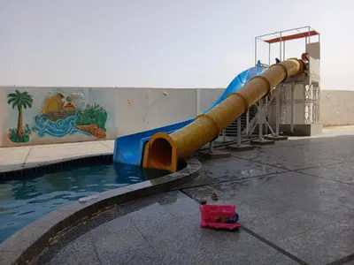 a water slide in a pool at a water park at شاليه فندقي فاخر كومباوند طيبة فيو حي الوزراء in Hurghada