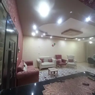 a living room with couches and a table at شقه للايجار اليومي بمدينة الغردقه مميزة جدا in Hurghada