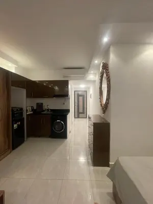 a large room with a kitchen and a living room at Florenza Khamsim 307 in Hurghada